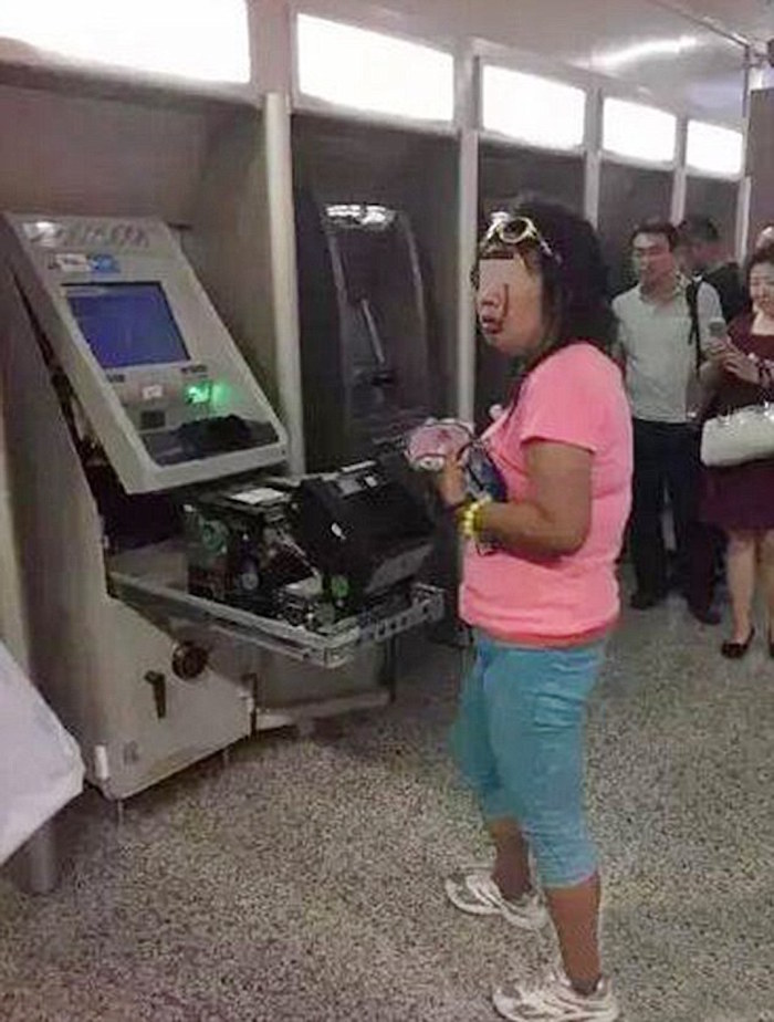 Woman Destroys ATM 4